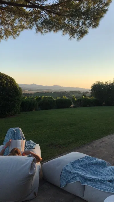 Lounge cushions on a lawn at sunset